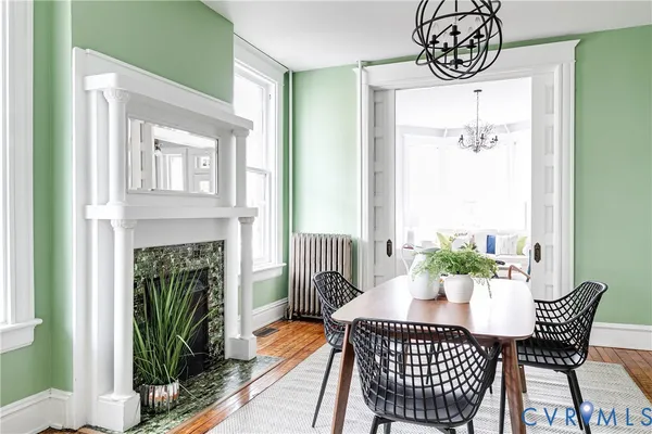 a dining room with furniture a livingroom and chandelier