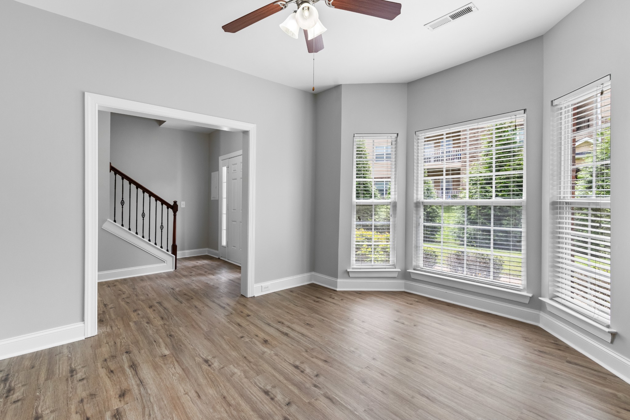 216 Rowlette Circle Murfreesboro, TN 37127 - Photo 13 of 36 a view of an empty room with wooden floor and a window