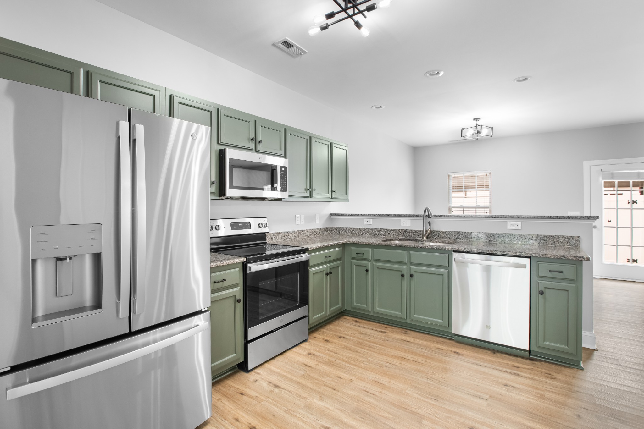 216 Rowlette Circle Murfreesboro, TN 37127 - Photo 15 of 36 a kitchen with granite countertop stainless steel appliances and wooden cabinets