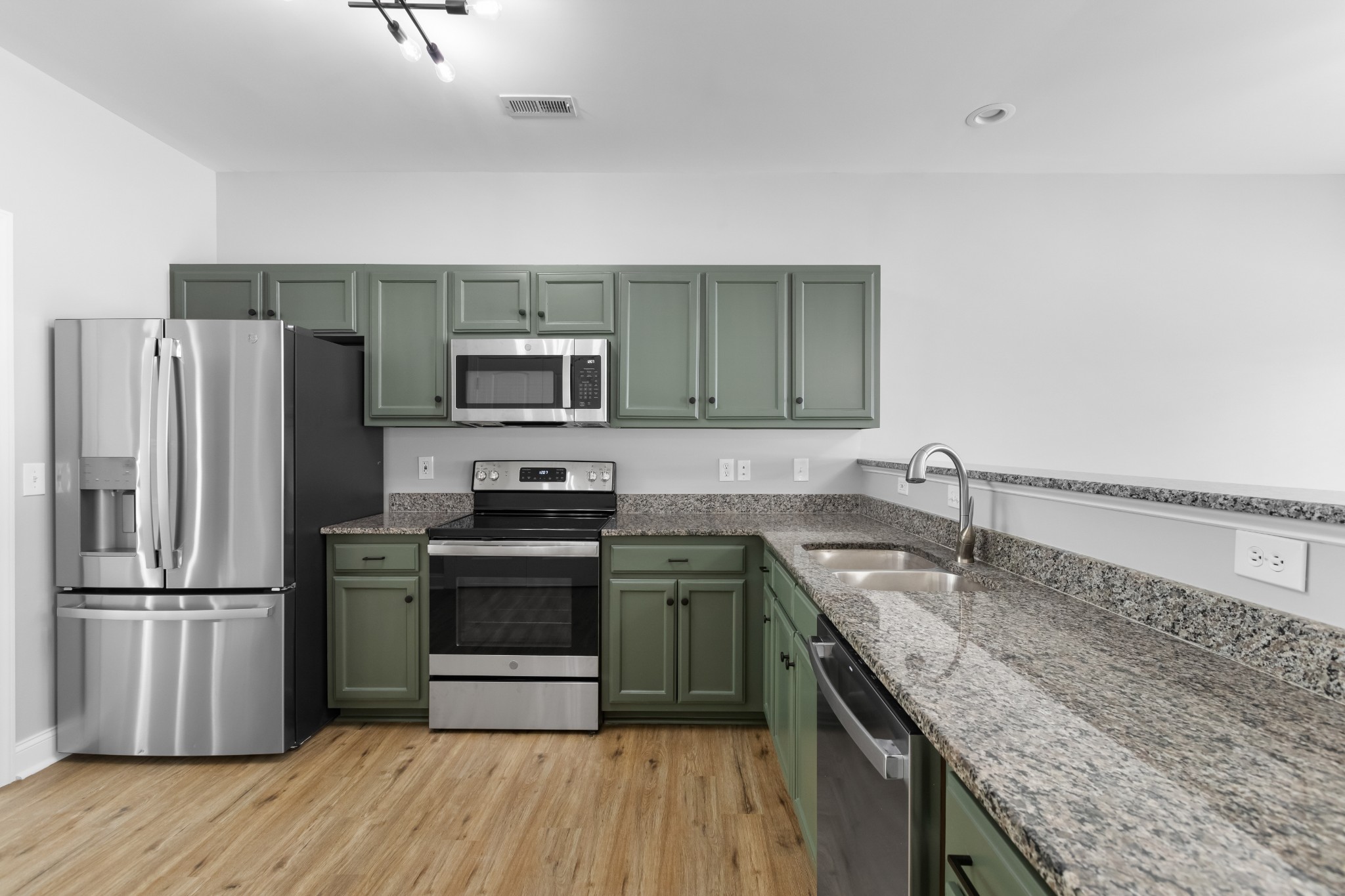 216 Rowlette Circle Murfreesboro, TN 37127 - Photo 17 of 36 a kitchen with stainless steel appliances granite countertop a sink stove and refrigerator