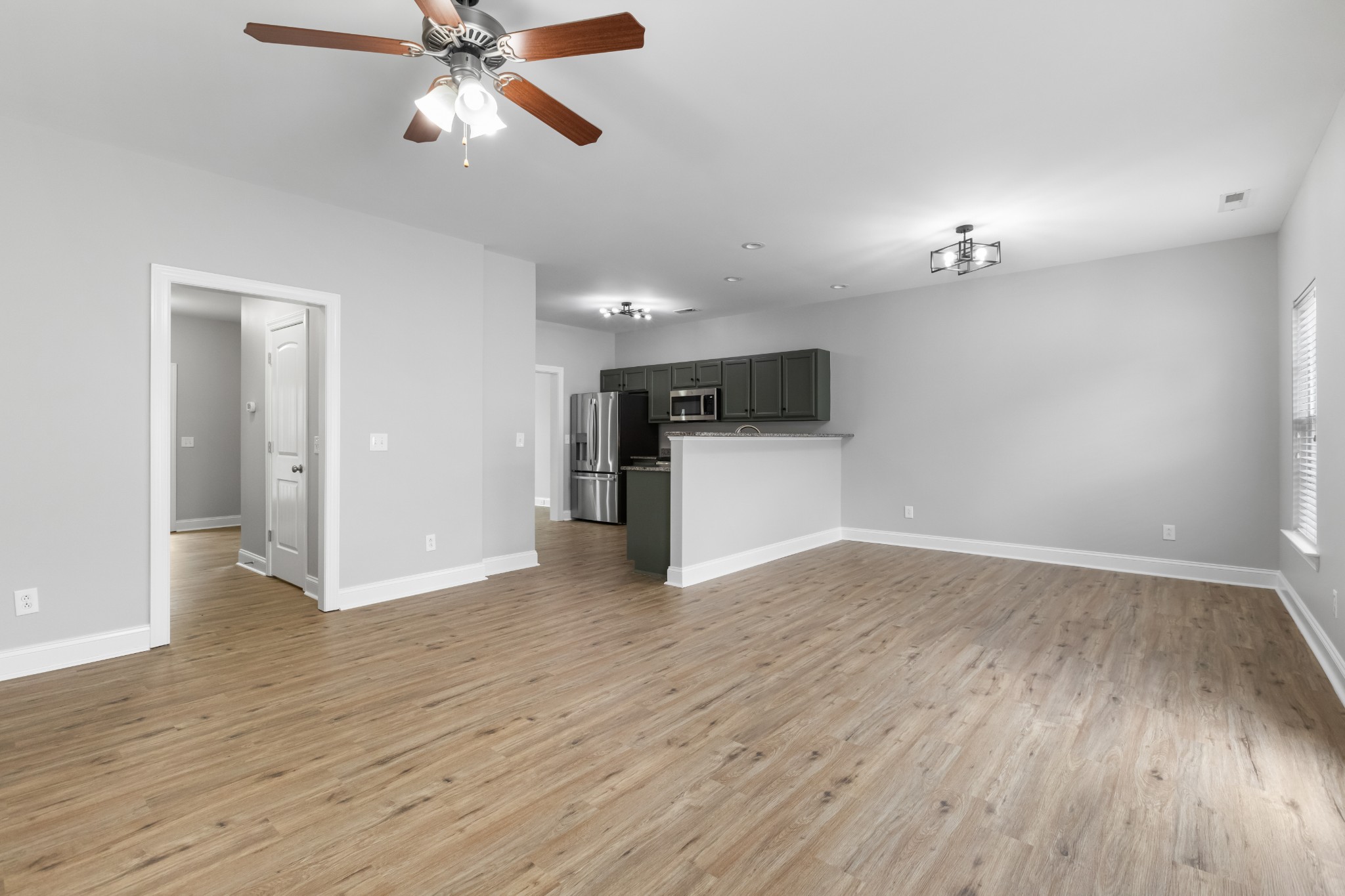 216 Rowlette Circle Murfreesboro, TN 37127 - Photo 18 of 36 a view of empty room with wooden floor and ceiling fan