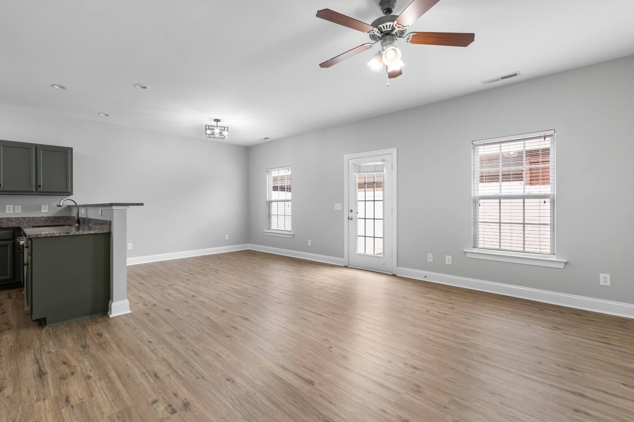 216 Rowlette Circle Murfreesboro, TN 37127 - Photo 19 of 36 a view of an empty room with window and wooden floor