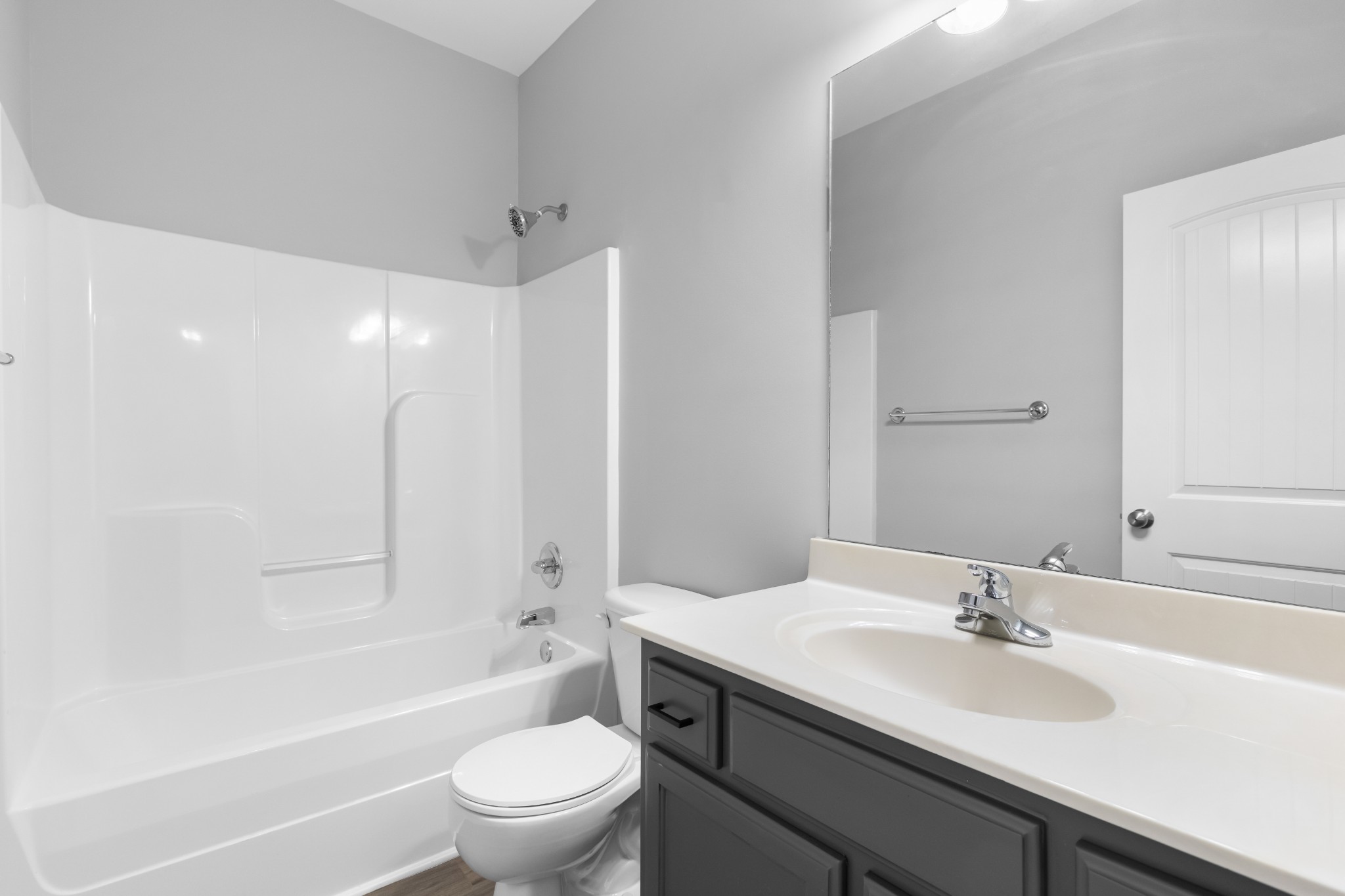 216 Rowlette Circle Murfreesboro, TN 37127 - Photo 29 of 36 a bathroom with a sink a toilet and a large mirror