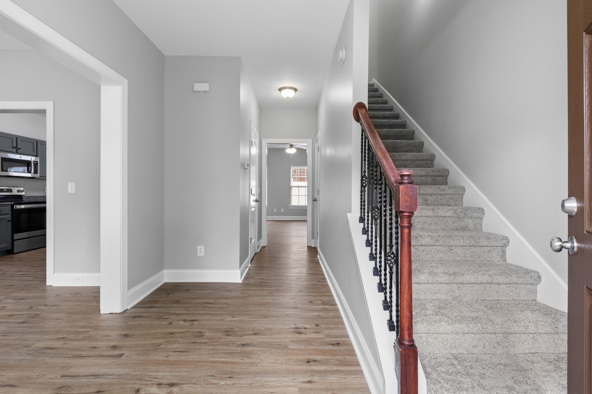 216 Rowlette Circle Murfreesboro, TN 37127 - Photo 10 of 36 a view of a hallway with wooden floor and stairs