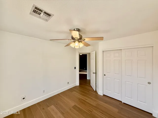 a view of a livingroom with wooden floor