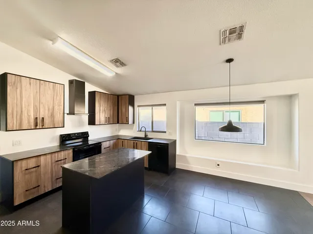 a kitchen with a stove and a sink