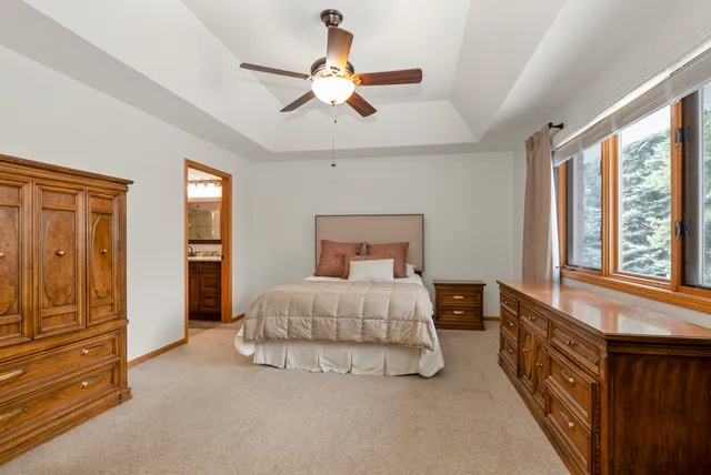 a bed room with a bed and a window