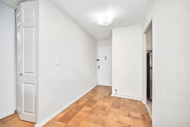 a view of a big room with windows and stairs
