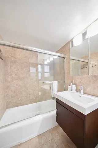 a kitchen with stainless steel appliances granite countertop a stove and a microwave