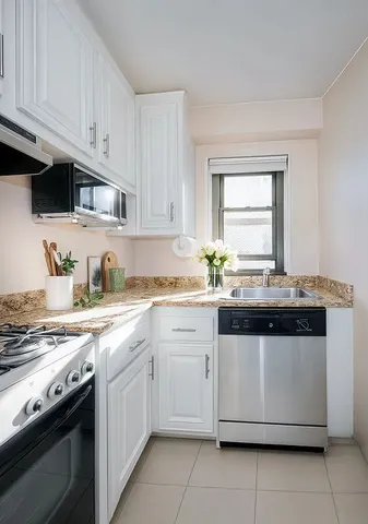 a spacious bedroom with a large bed and a couch