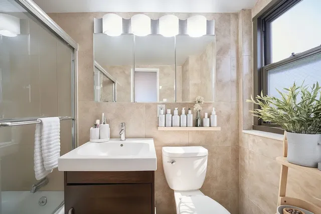 a kitchen with stainless steel appliances granite countertop a sink and a stove