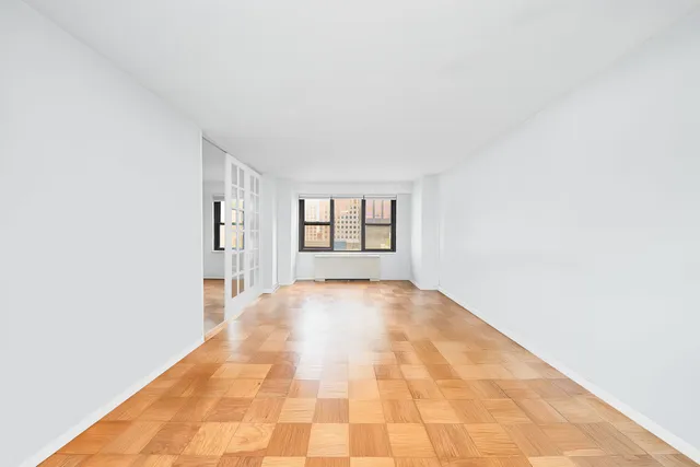 a view of an empty room with a window