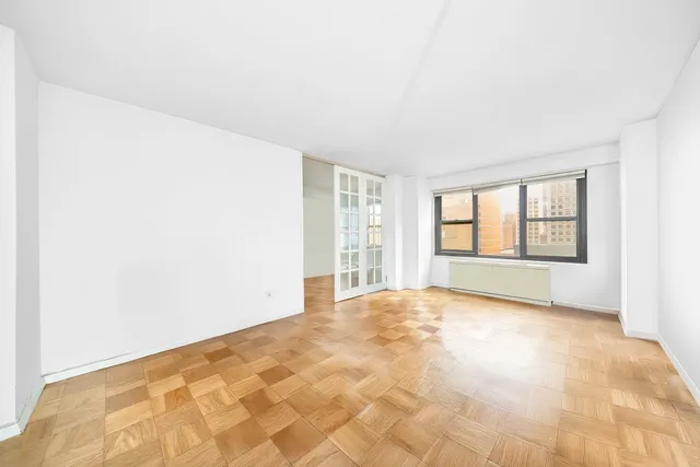 a view of an empty room and window
