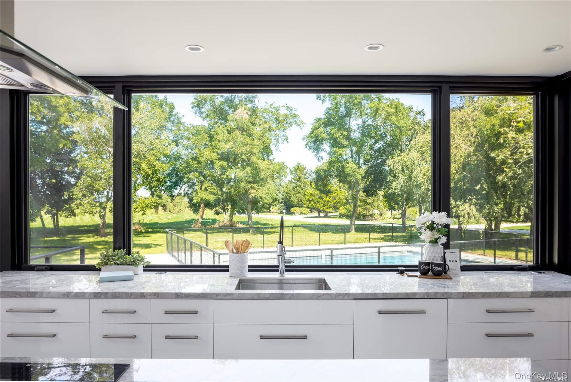 290 Windward Road Orient, NY 11957 - Photo 16 of 31 a kitchen with a large window and sink