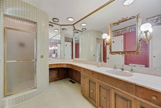 a view of an empty room with chandelier