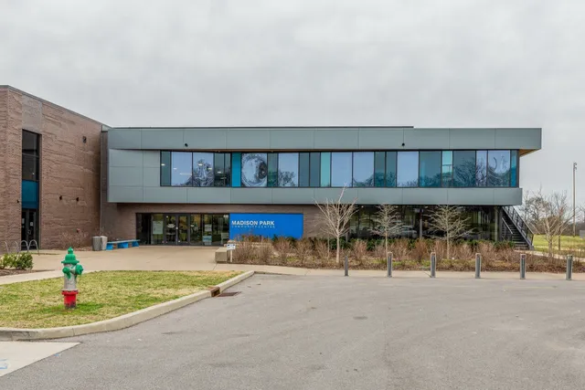 a swimming pool with outdoor seating