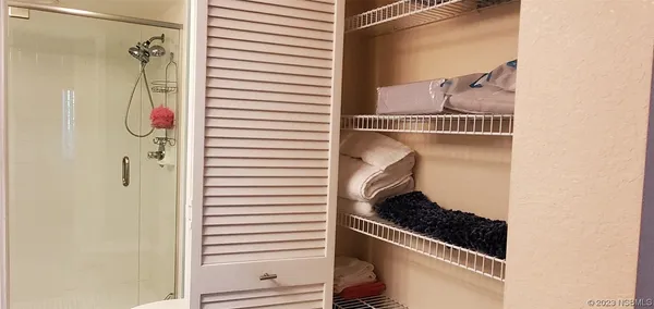 a balcony with furniture and a potted plant