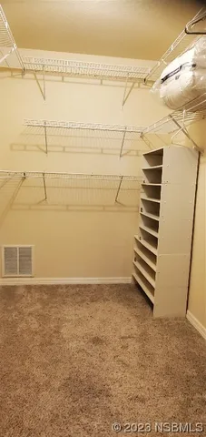 a view of a garden with a house