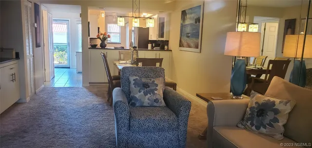 a kitchen with stainless steel appliances granite countertop a refrigerator and a stove