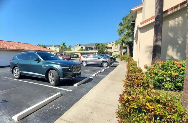 a bathroom with a granite countertop shower sink and mirror