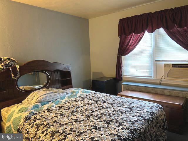 101 West Ruddle Street Coaldale, PA 18218 - Photo 18 of 26 a bedroom with a bed and a dresser