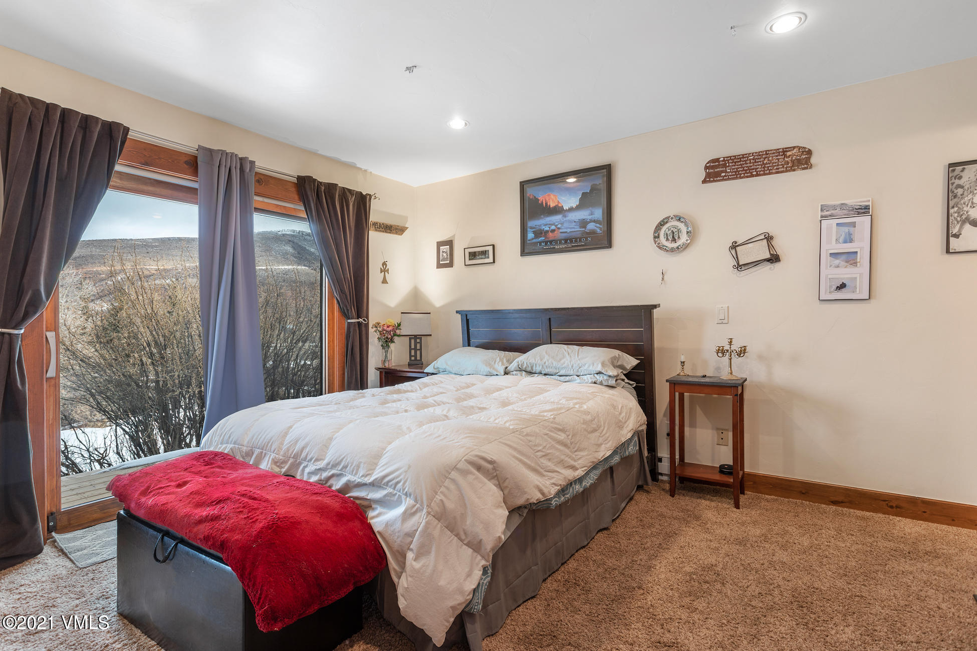 596 Daisy Lane, Unit 5 Avon, CO 81620 - Photo 13 of 23 a bedroom with a bed and a large window