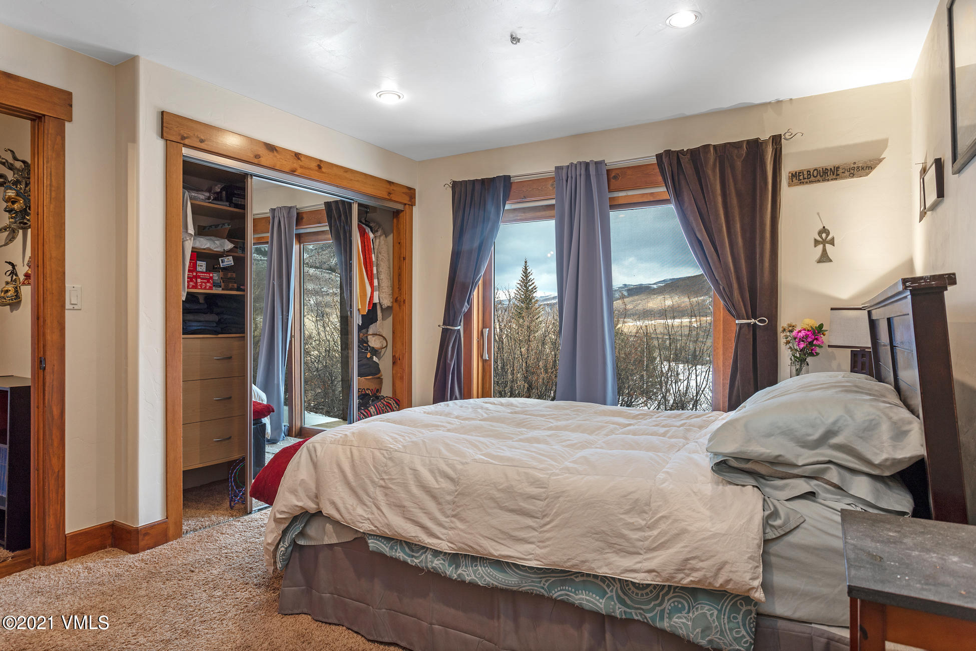596 Daisy Lane, Unit 5 Avon, CO 81620 - Photo 14 of 23 a bed sitting in a bedroom next to a window