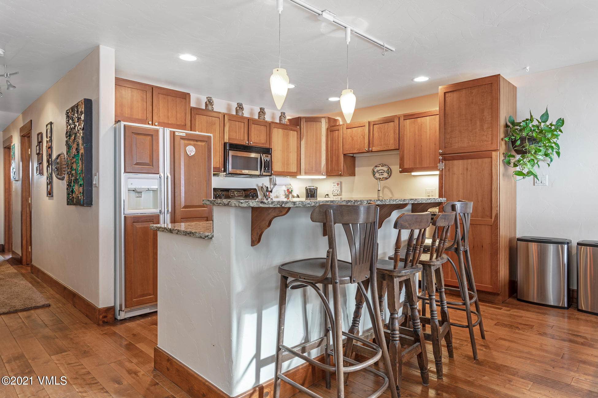 596 Daisy Lane, Unit 5 Avon, CO 81620 - Photo 3 of 23 a kitchen with stainless steel appliances a refrigerator a stove top oven a sink and cabinets