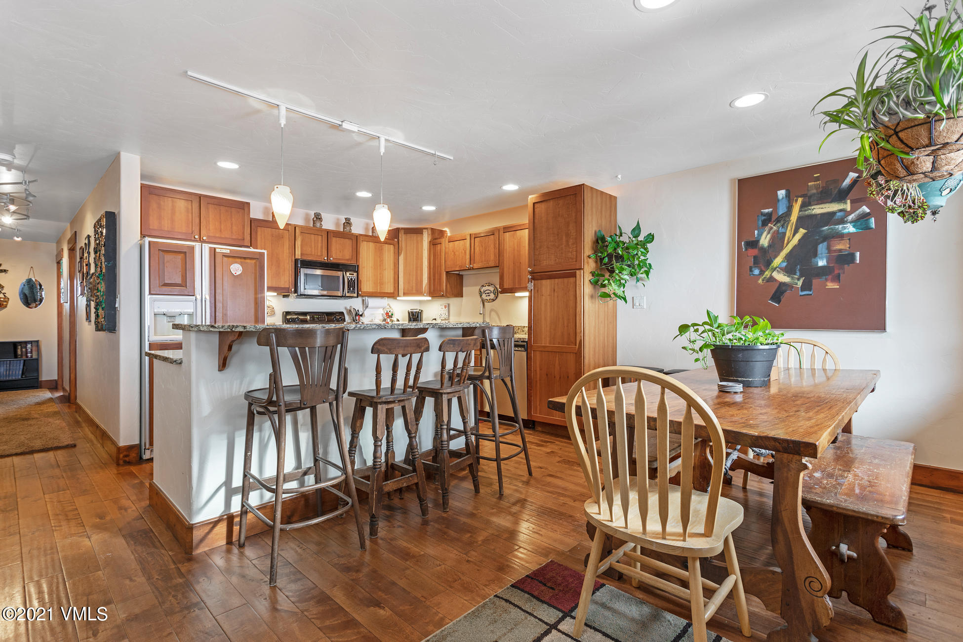 596 Daisy Lane, Unit 5 Avon, CO 81620 - Photo 4 of 23 a view of a dining room with furniture and a potted plant