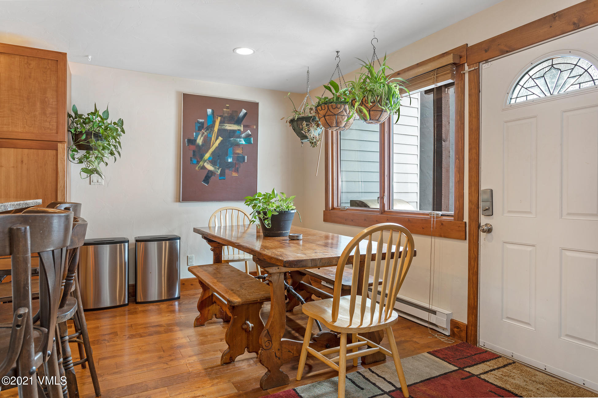 596 Daisy Lane, Unit 5 Avon, CO 81620 - Photo 5 of 23 a view of a dining room with furniture window and wooden floor