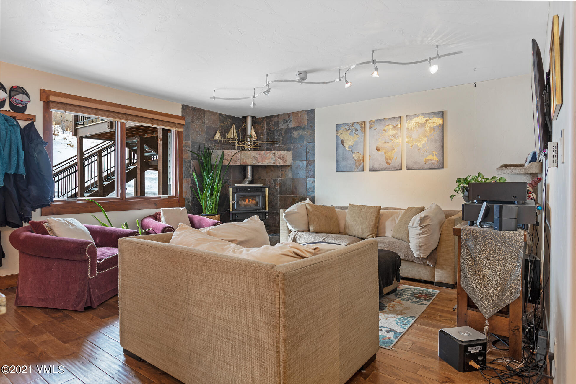 596 Daisy Lane, Unit 5 Avon, CO 81620 - Photo 7 of 23 a living room with furniture and a fireplace