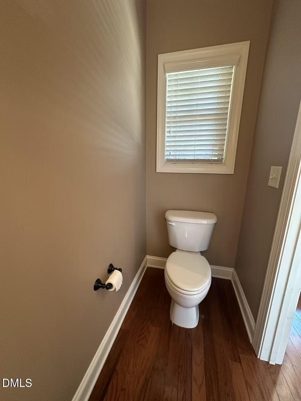 1056 Indigo Ridge Place Cary, NC 27519 - Photo 16 of 33 a bathroom with a toilet and a sink