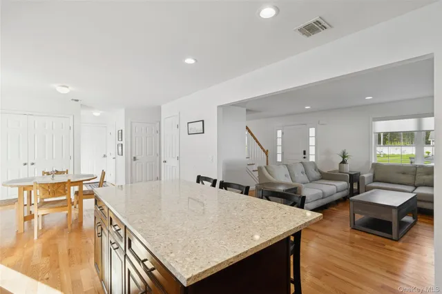a living room with lots of furniture and a table