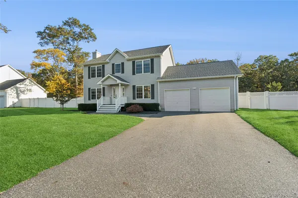 front view of a house with a yard