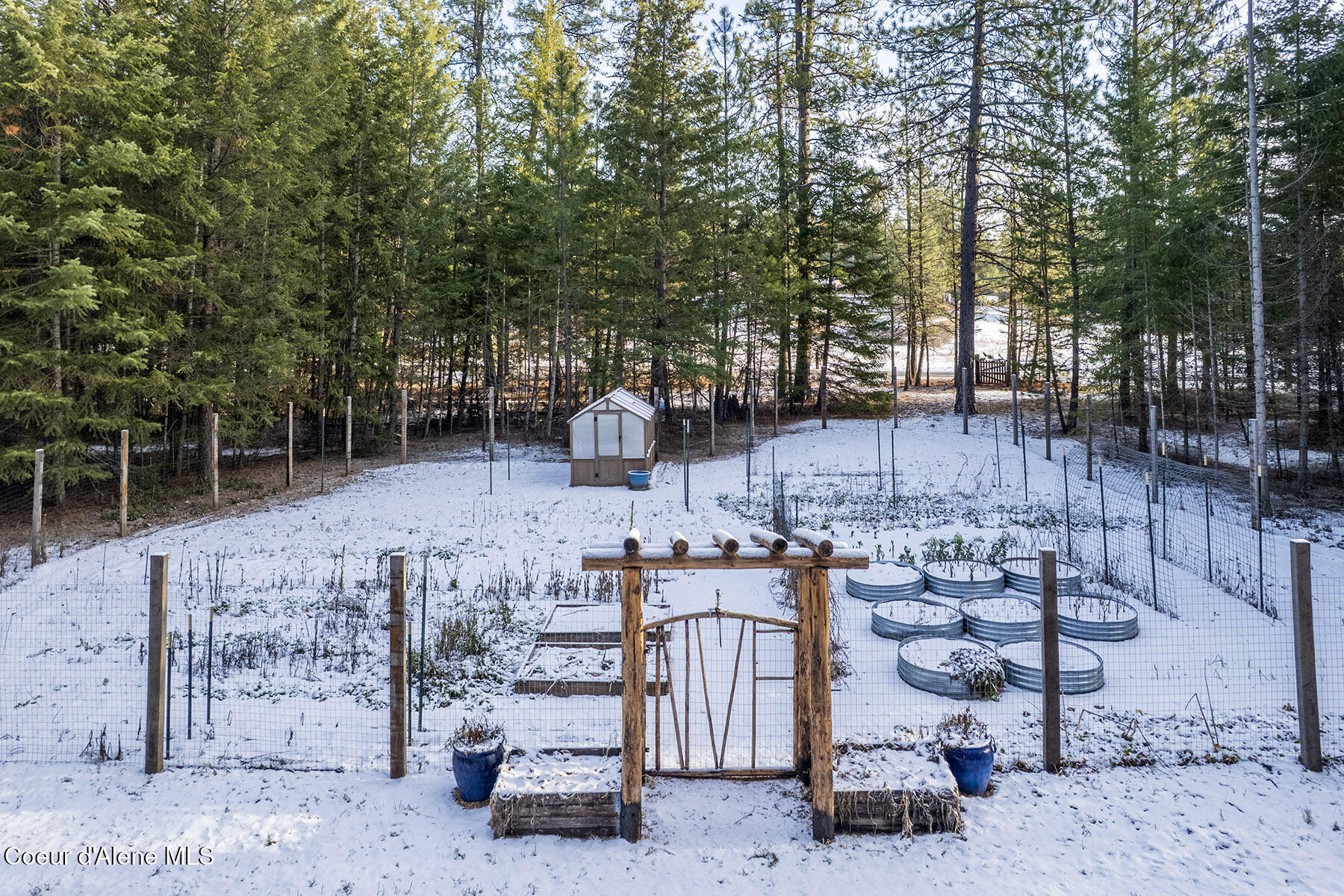 13757 North Idaho Road Rathdrum, ID 83858 - Photo 23 of 48 Large fenced garden w/greenhouse