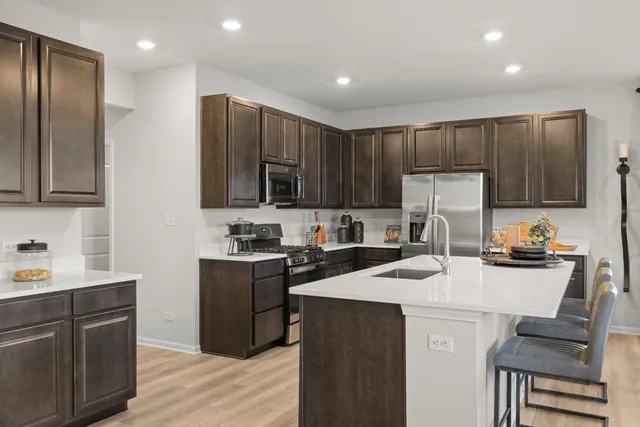 a kitchen with a sink a stove and refrigerator