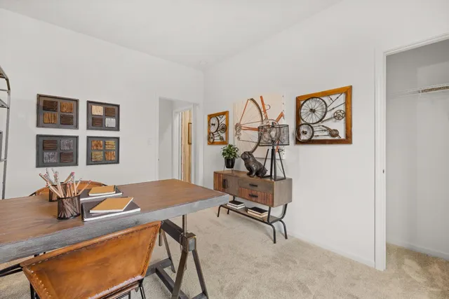 a view of a workspace with furniture