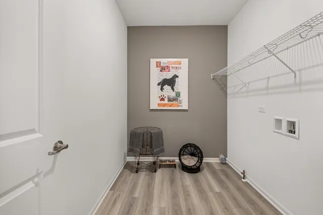 a view of a livingroom with furniture and hardwood floor