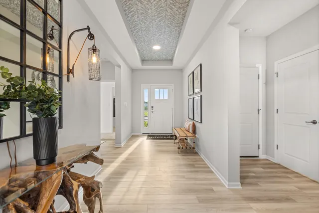 a view of a livingroom with furniture and entryway