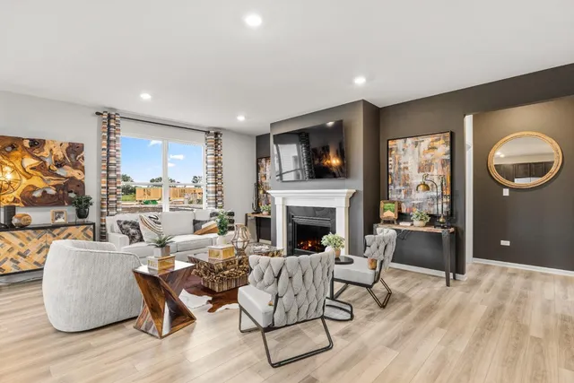 a living room with fireplace furniture and a flat screen tv