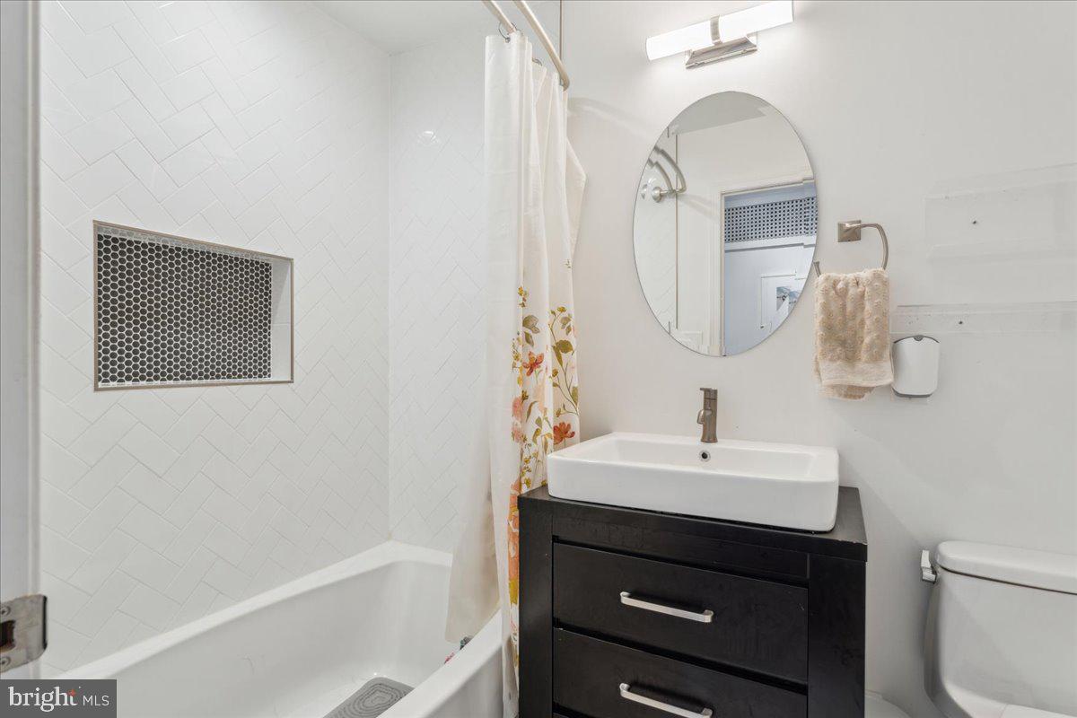 5222 Ferndale Street Springfield, VA 22151 - Photo 14 of 33 a bathroom with a sink vanity and a mirror