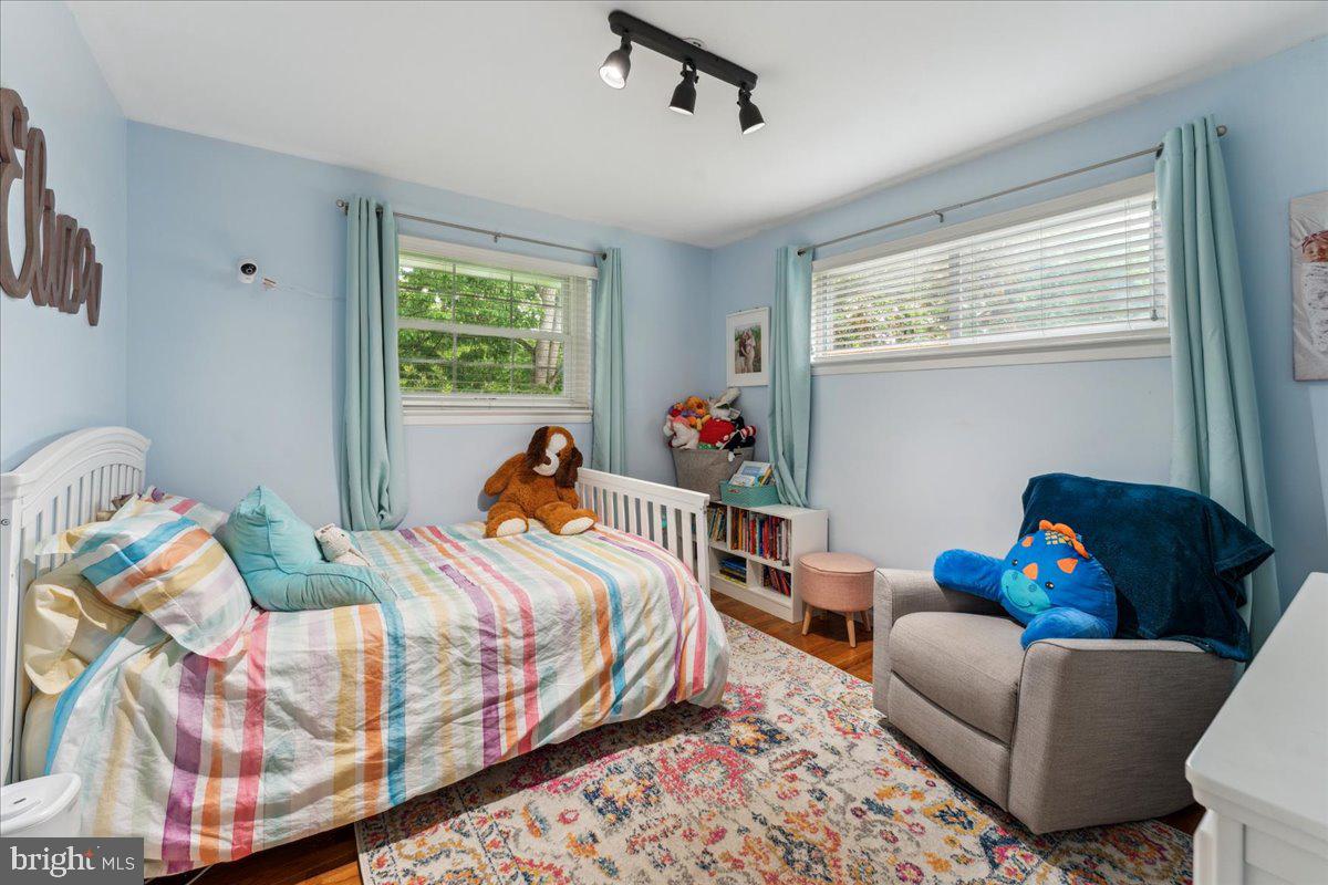 5222 Ferndale Street Springfield, VA 22151 - Photo 16 of 33 a bed room with a bed and a couch