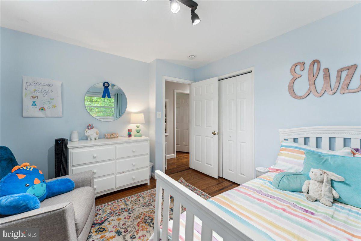 5222 Ferndale Street Springfield, VA 22151 - Photo 17 of 33 a bedroom with a bed and a dresser in it