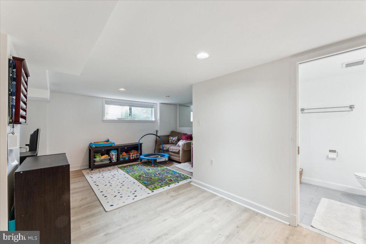5222 Ferndale Street Springfield, VA 22151 - Photo 22 of 33 a living room with furniture and a flat screen tv