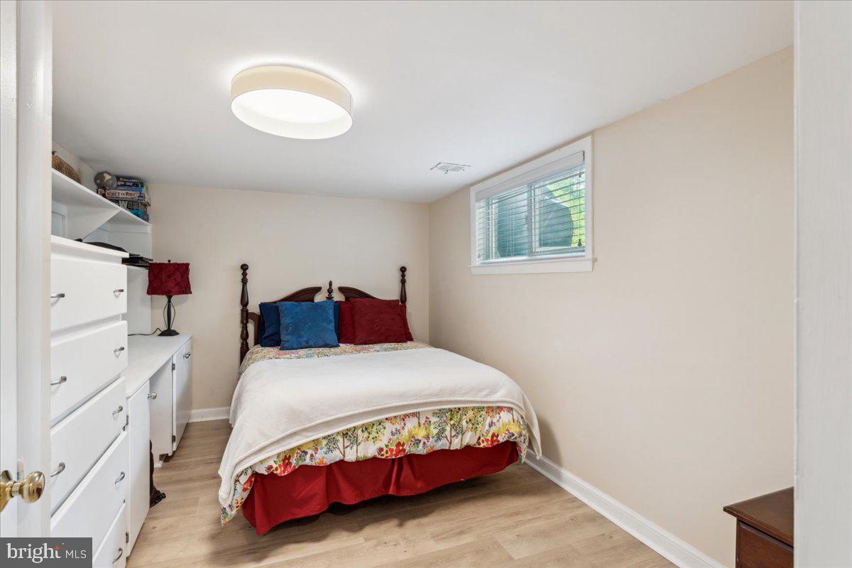 5222 Ferndale Street Springfield, VA 22151 - Photo 23 of 33 a bedroom with a bed and a dresser