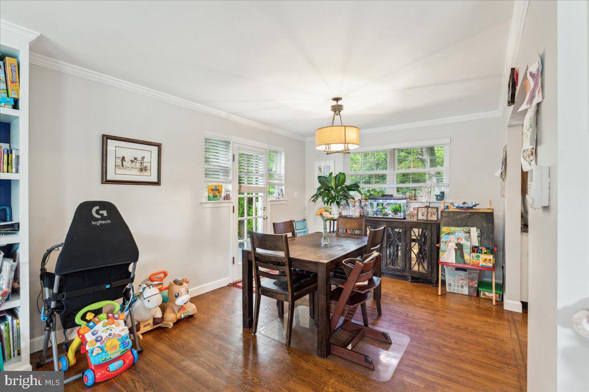 5222 Ferndale Street Springfield, VA 22151 - Photo 10 of 33 a view of a dining room with furniture and wooden floor