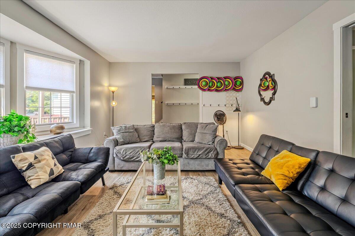 2102 Woodland Court Pocono Summit, PA 18346 - Photo 12 of 42 a living room with furniture and a rug