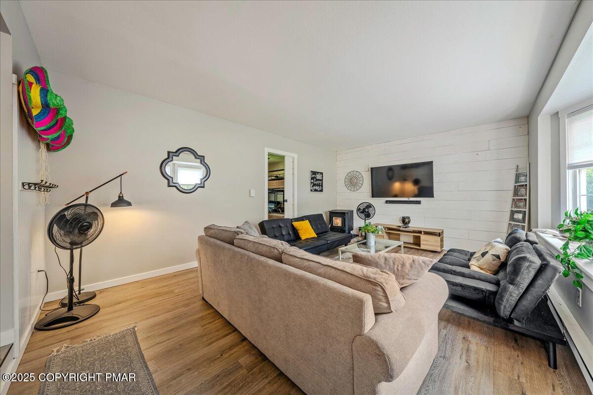 2102 Woodland Court Pocono Summit, PA 18346 - Photo 13 of 42 a living room with furniture and a flat screen tv