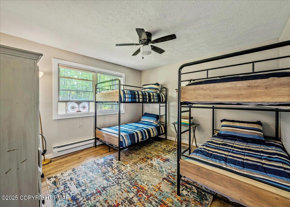 2102 Woodland Court Pocono Summit, PA 18346 - Photo 14 of 42 a bedroom with furniture and a window