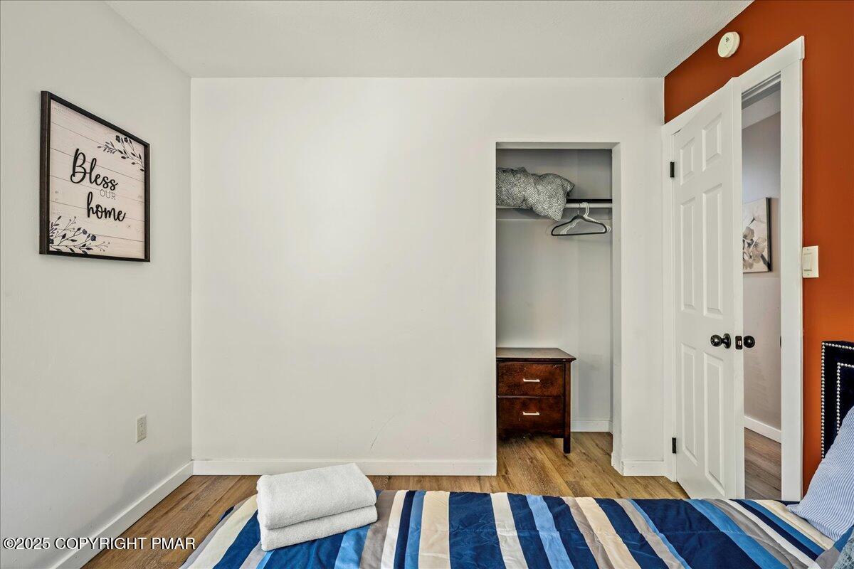 2102 Woodland Court Pocono Summit, PA 18346 - Photo 26 of 42 a view of a hallway with wooden floor and closet